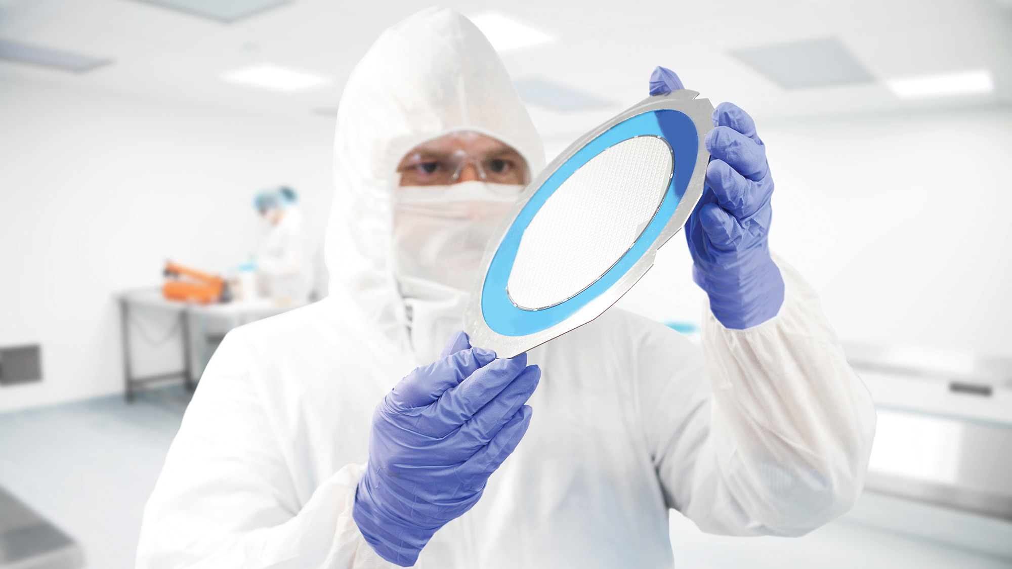 Photo of a water being held by a person in a cleanroom - Integrity Cleanroom